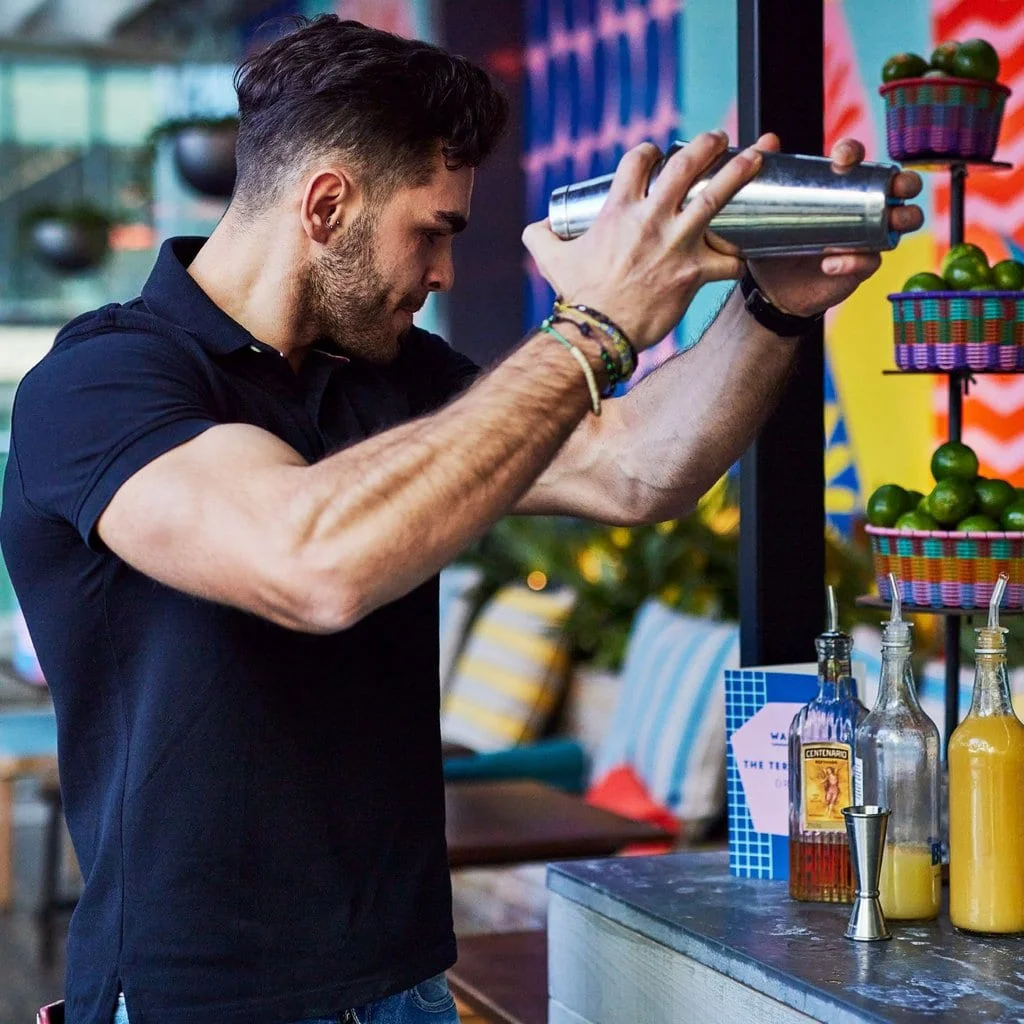 Cocktails being freshly shaken in the bar at Wahaca Canary Wharf