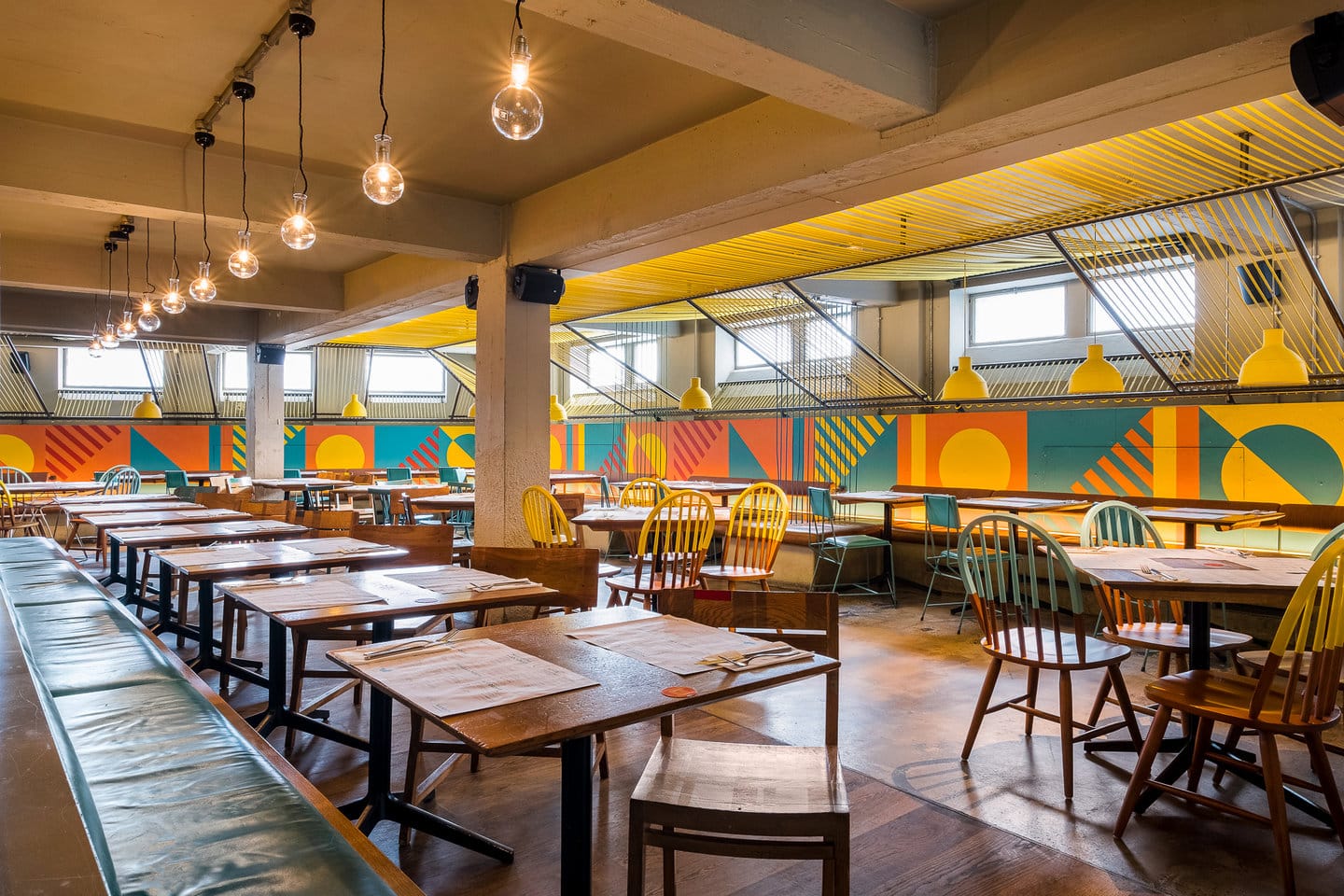 restaurant seating and wall mural design art at wahaca waterloo